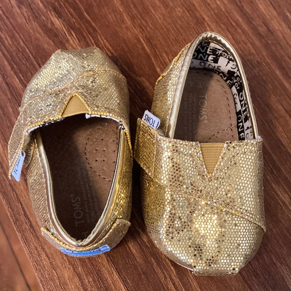 Like new gold glitter Toms for babies
